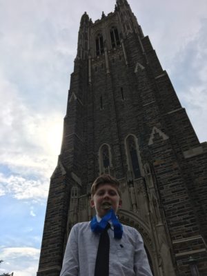 Carter bites his medal like an Olympian in front of the Duke Chapel. Carter bites his medal like an Olympian in front of the Duke Chapel.